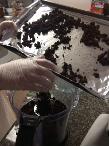 Grind the chocolate brownie crumble in a food processor before molding to your pie plate.